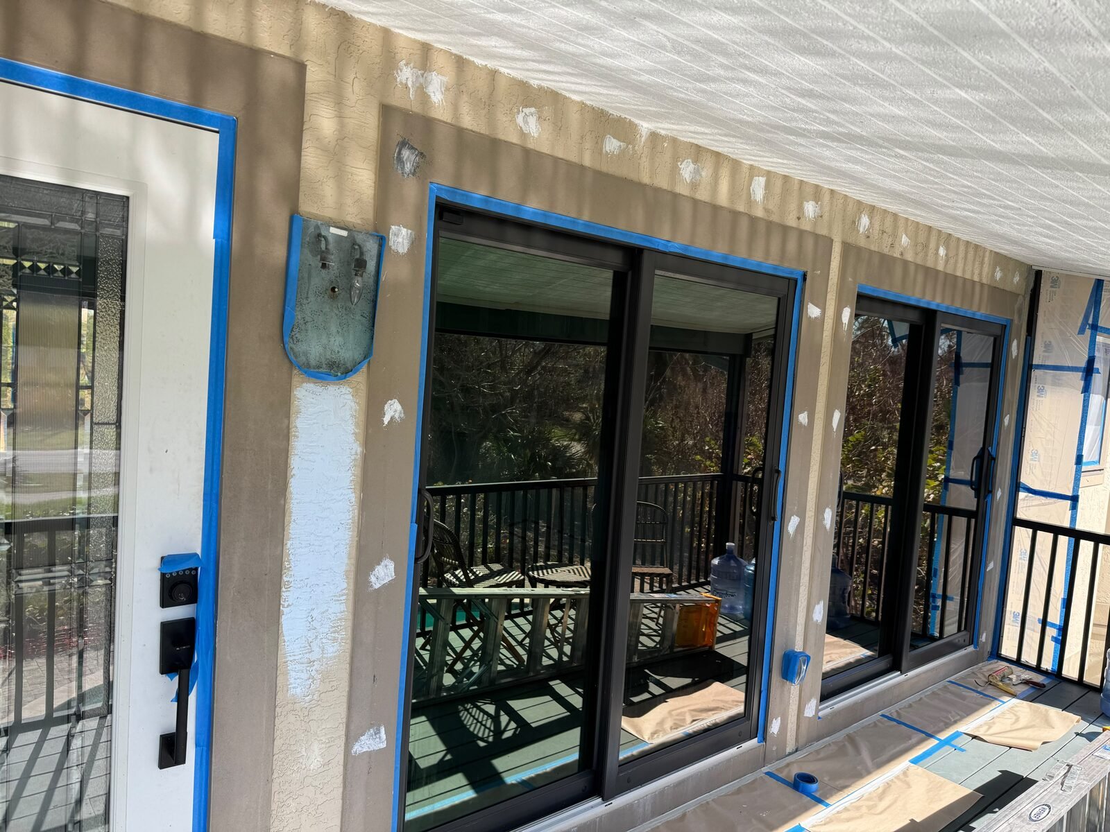 Exterior wall prepared and masked for painting