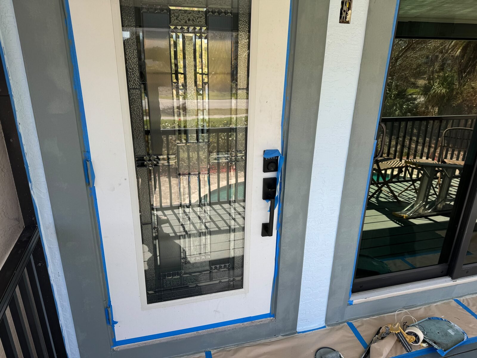 Exterior door carefully masked before painting